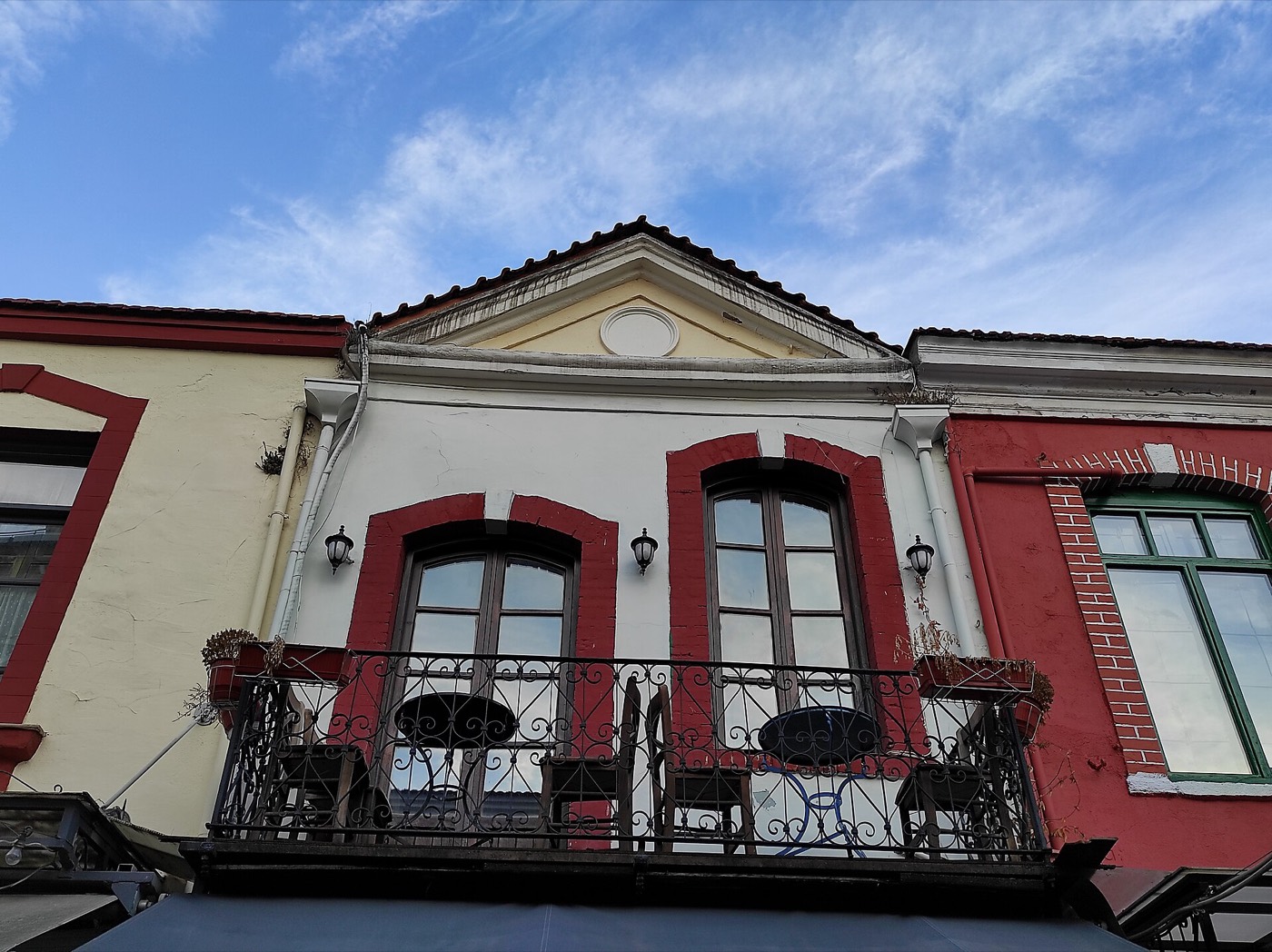 Restored colourful facades with balconies in the Ladadika district