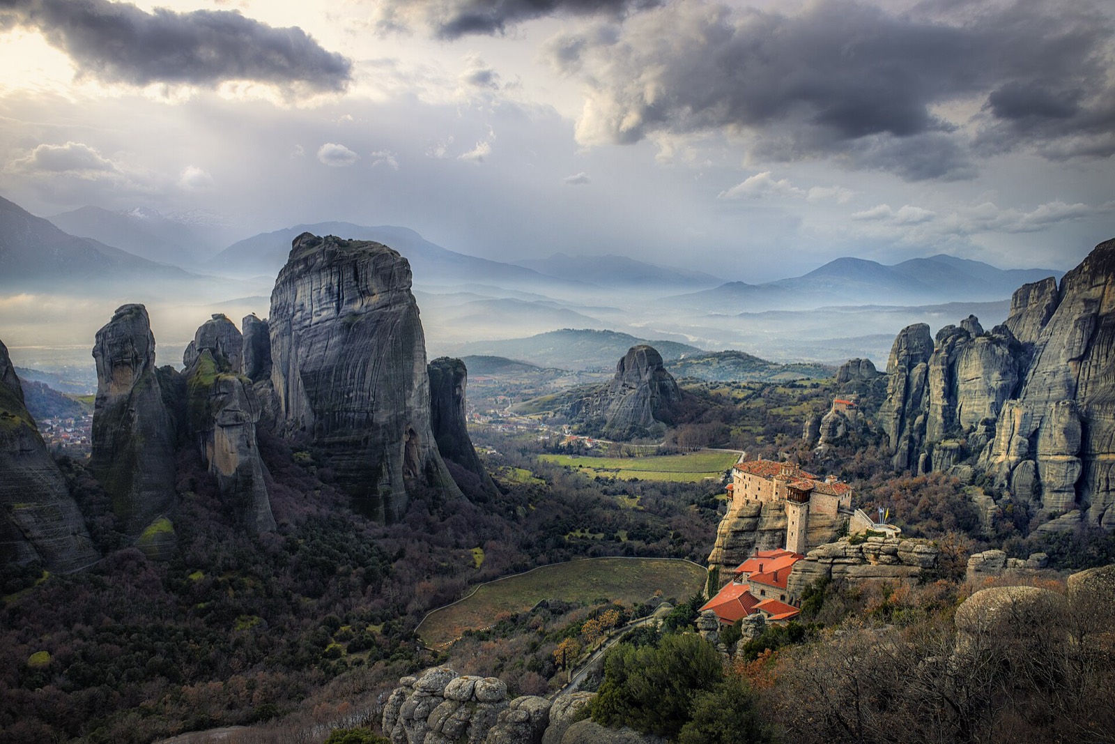 A monastery perched on top of a sheer rock pillar at Meteora
