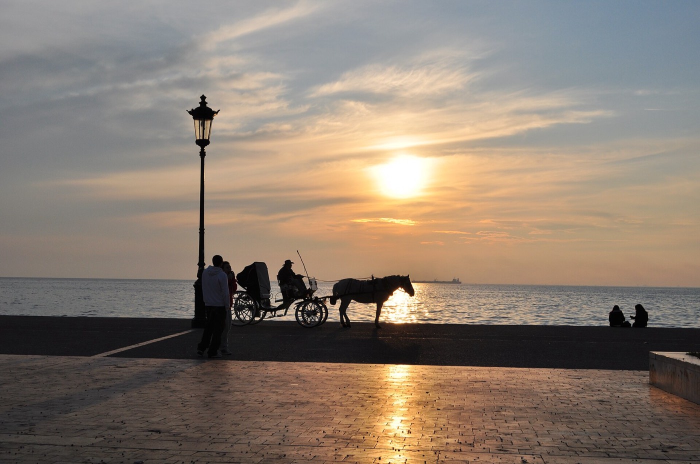 Cyclists and walkers on the landscaped Nea Paralia seafront